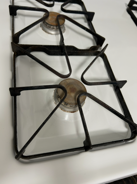 Gas stove top and burner grates cleaned and degreased